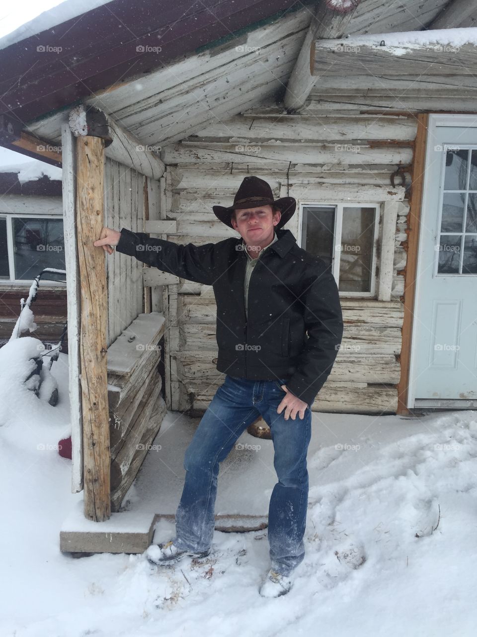 Cowboy in snow. One snowy day on a ranch in southeast Wyoming