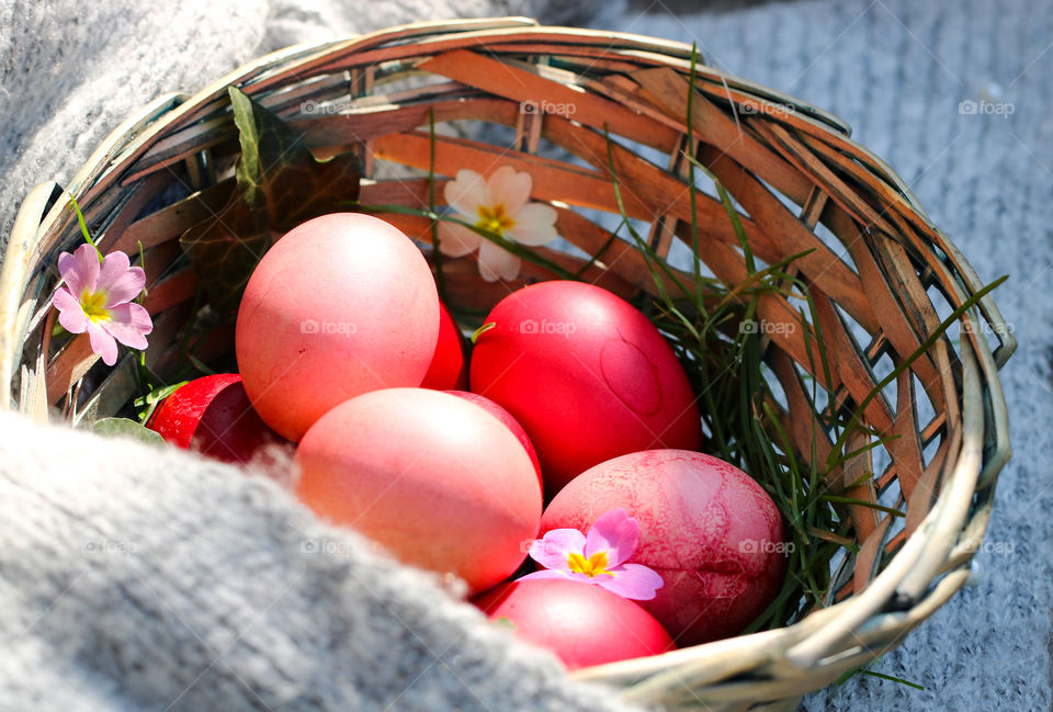 Basket with colorful eggs