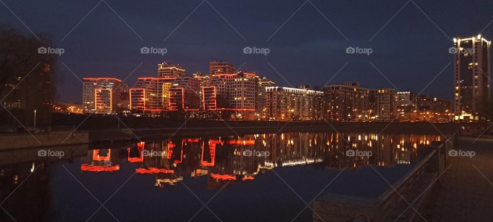 beautiful night light street view, windows magic light, cityscape and reflection in water