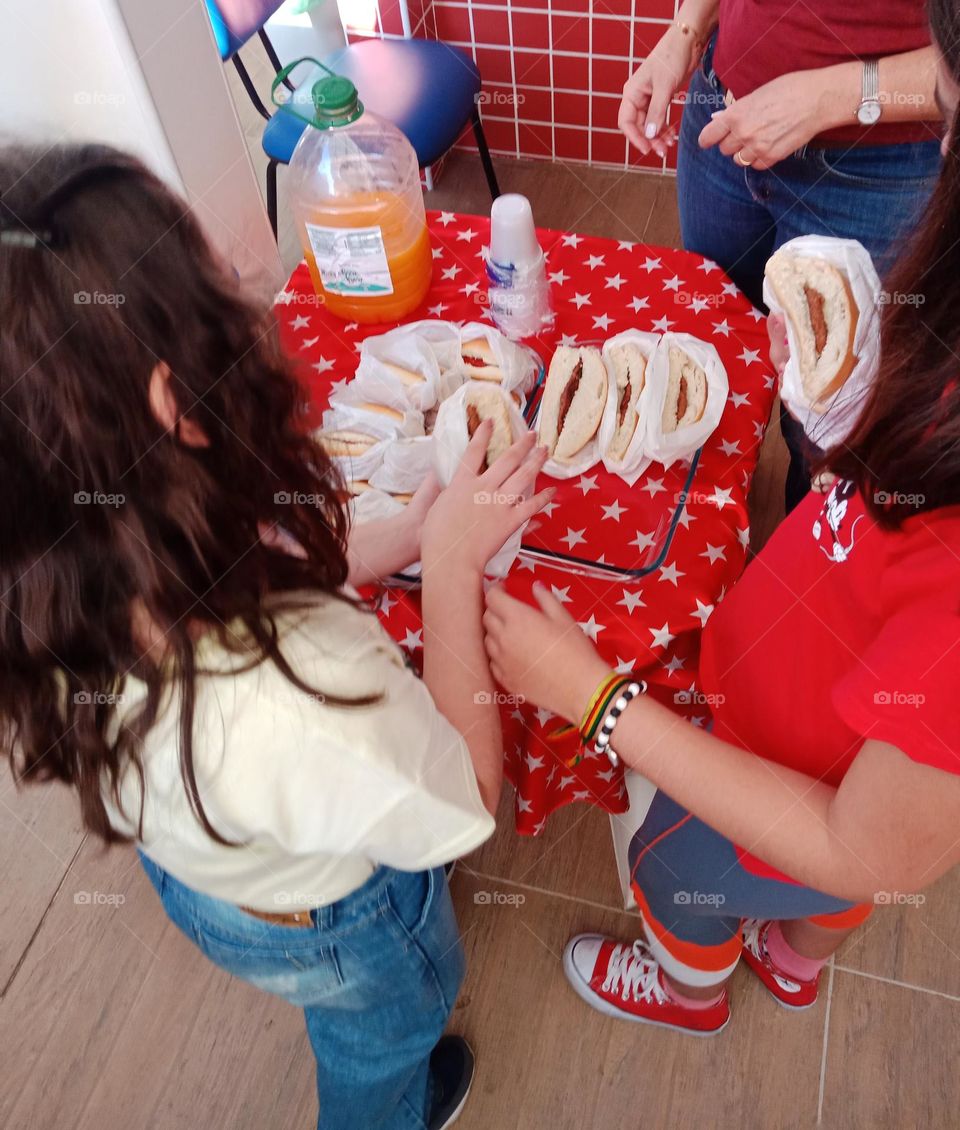 Girls Preparing hamburgers on 4th of July