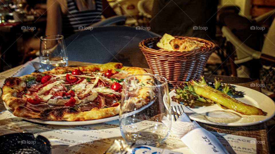 pizza capricossa, pepper and bread