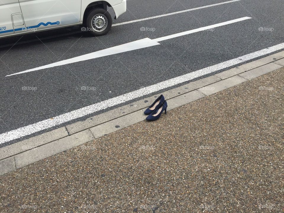 A lonely pair of high heels standing on the street in japan