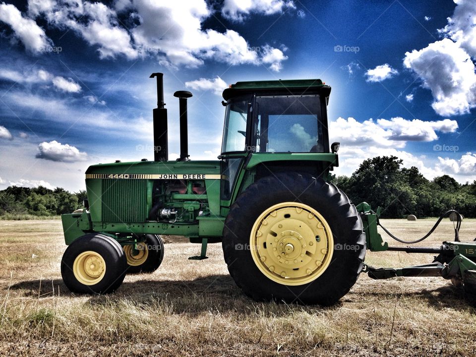 All in a day's work. Tractor in a field