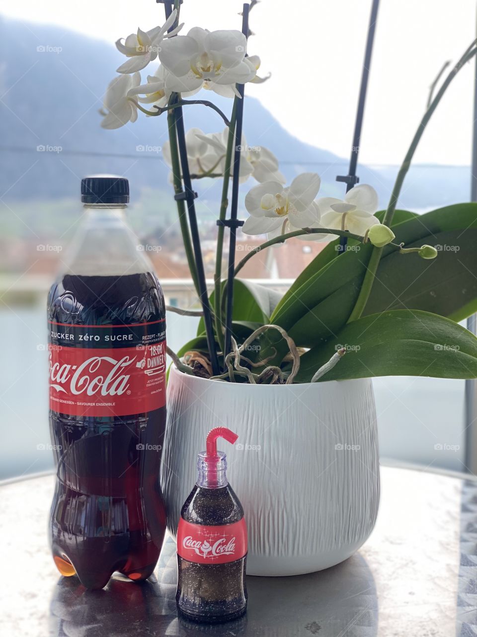 coca cola on the background of flowers