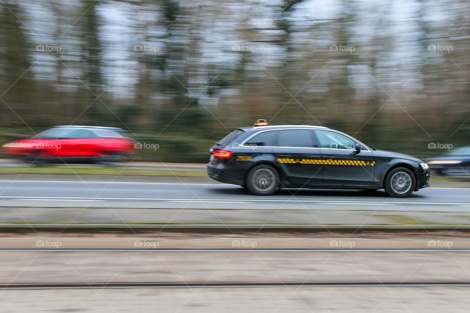 Taxi in motion in a road