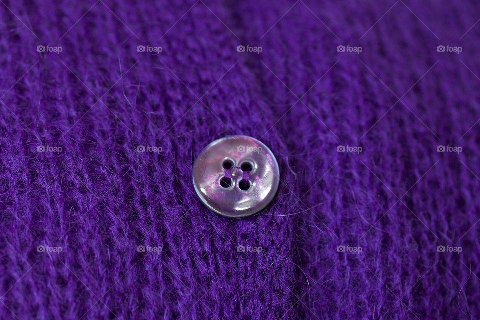 Full frame of purple cardigan sweater