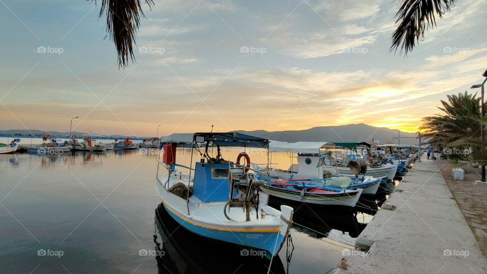 Sunset and boats in Skala Kallonis. It makes me calm and happy.