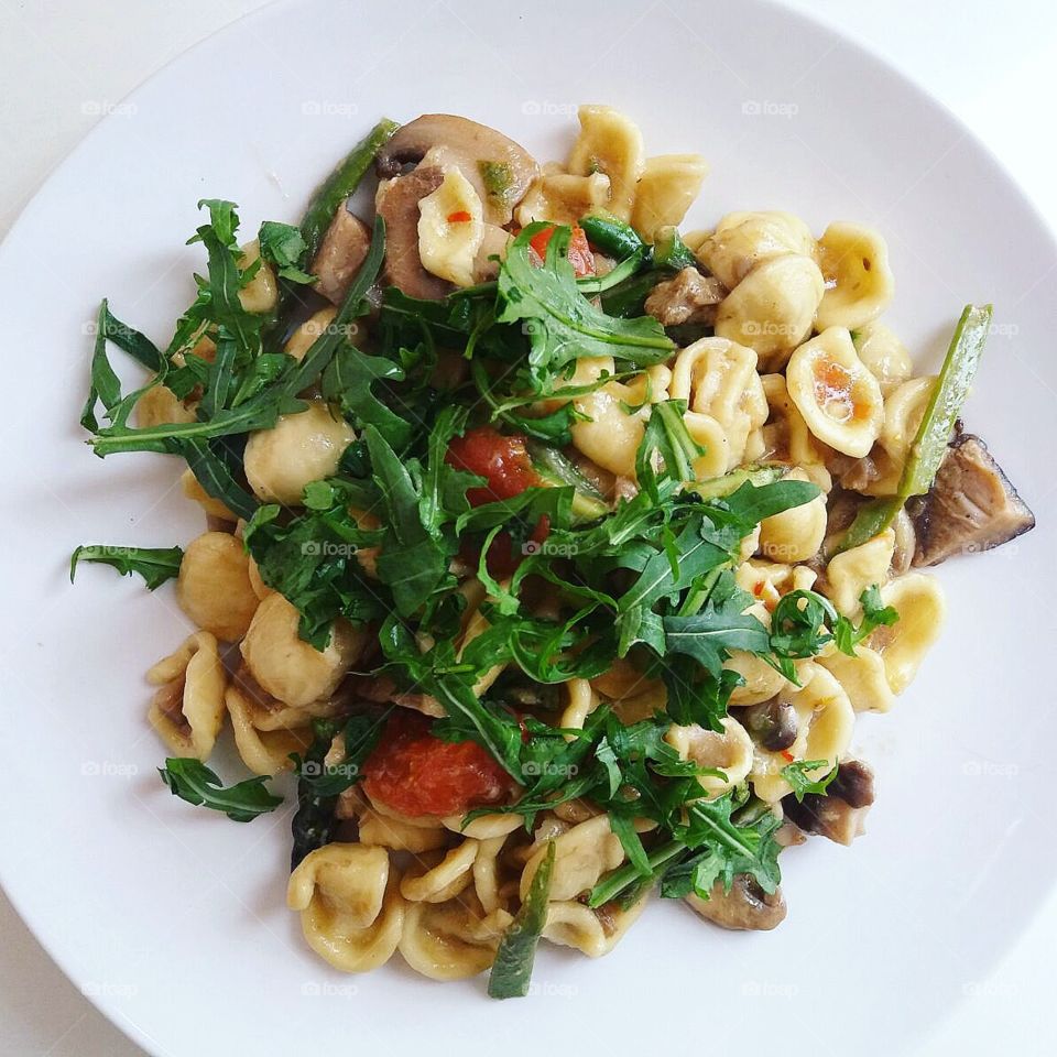 pasta with mushrooms and rocket salad