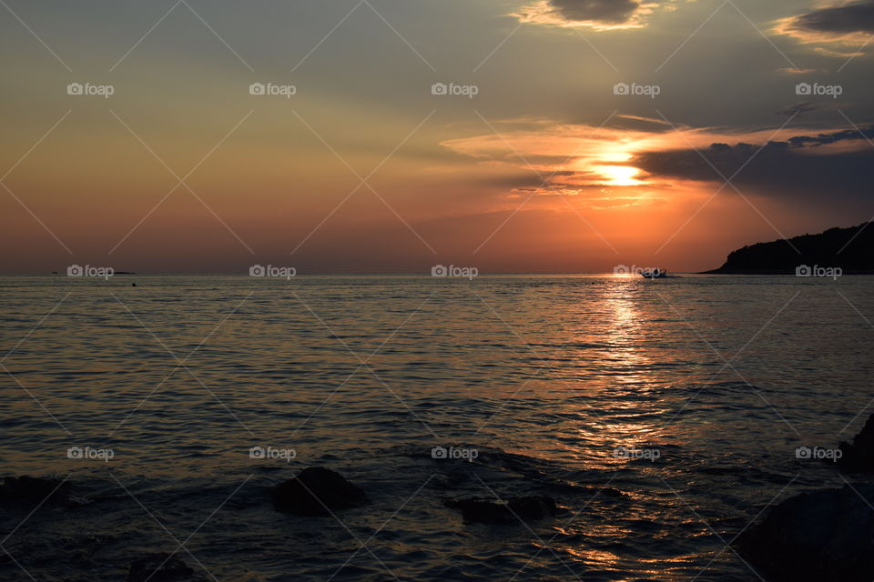 Sunset with speedboat