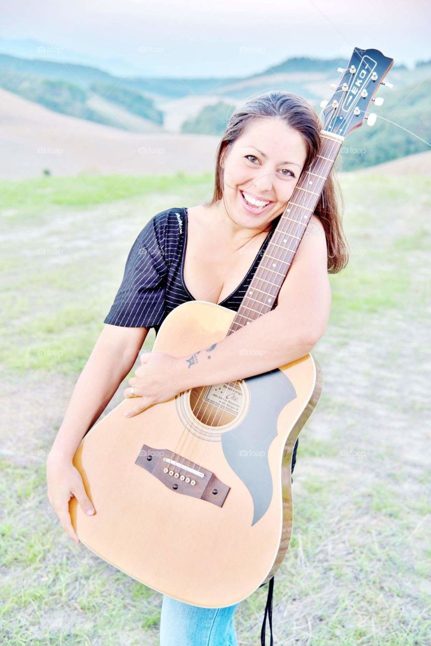 Countryside and music, guitar, woman, female creativity