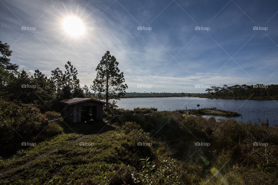 House at the reservoir in the forest 