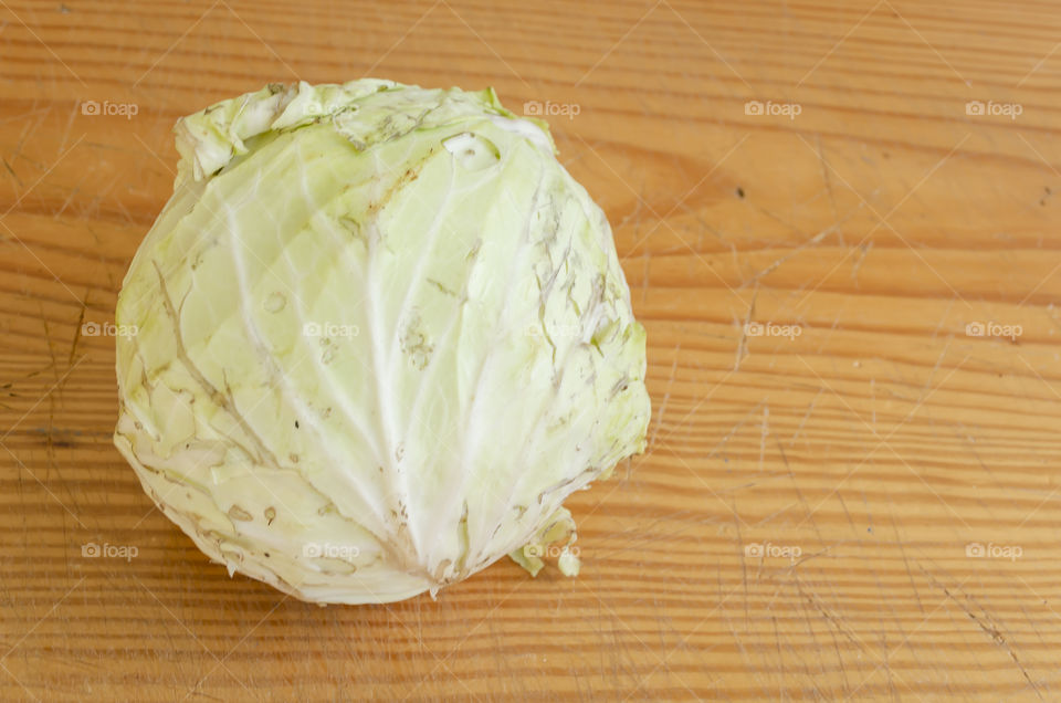 White Cabbage On Wooden Background