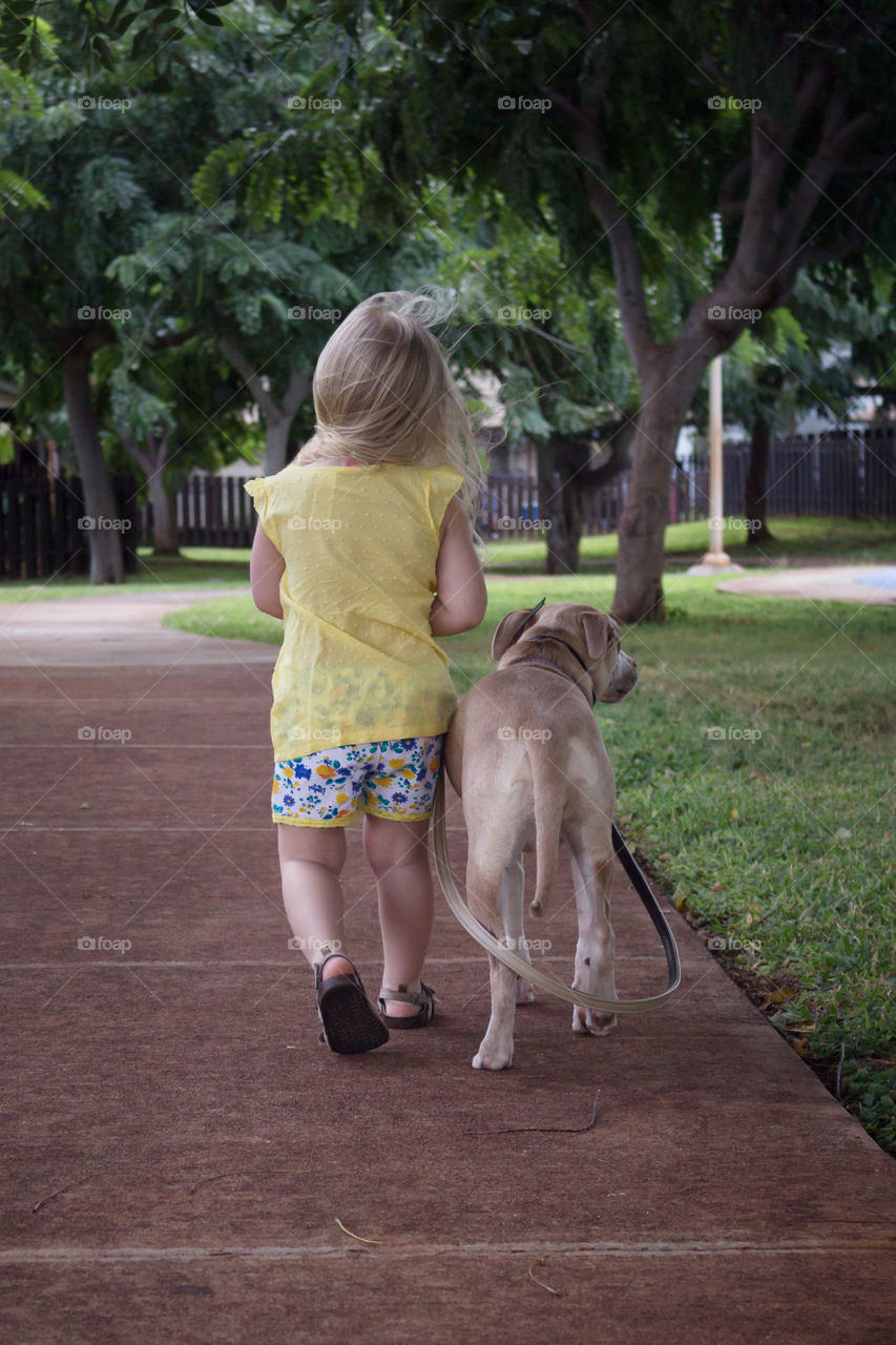 my daughter walking her puppy