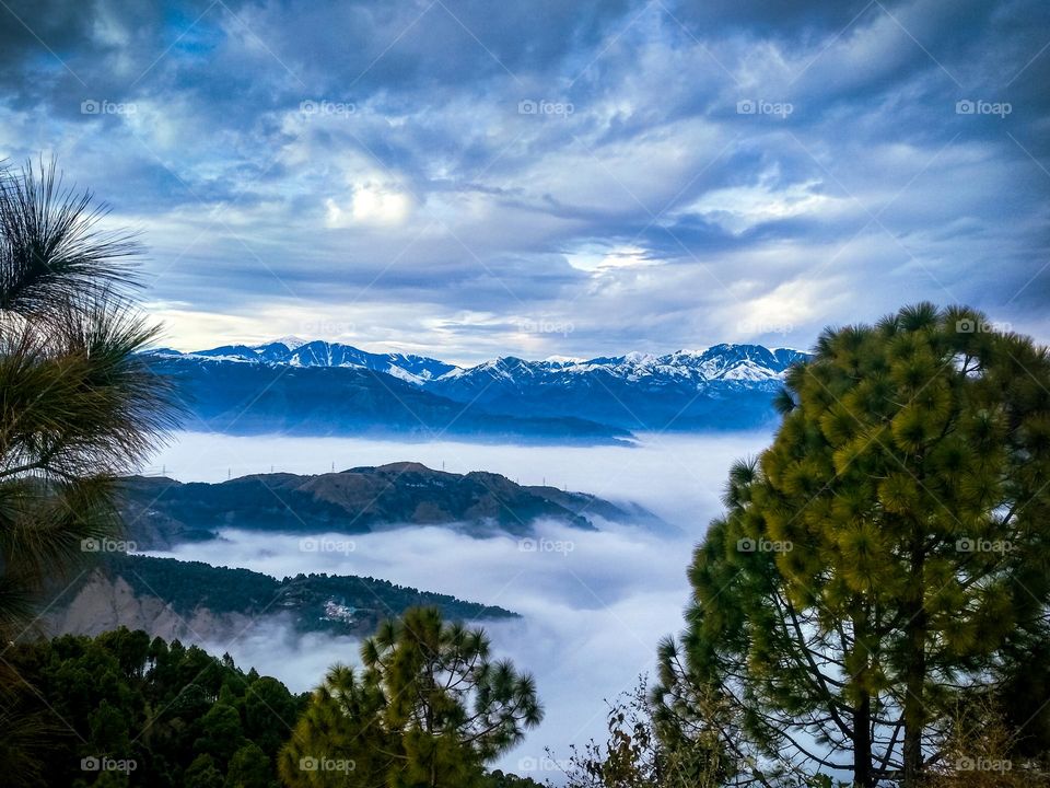 clouds between the mountains and amazing surrounding.