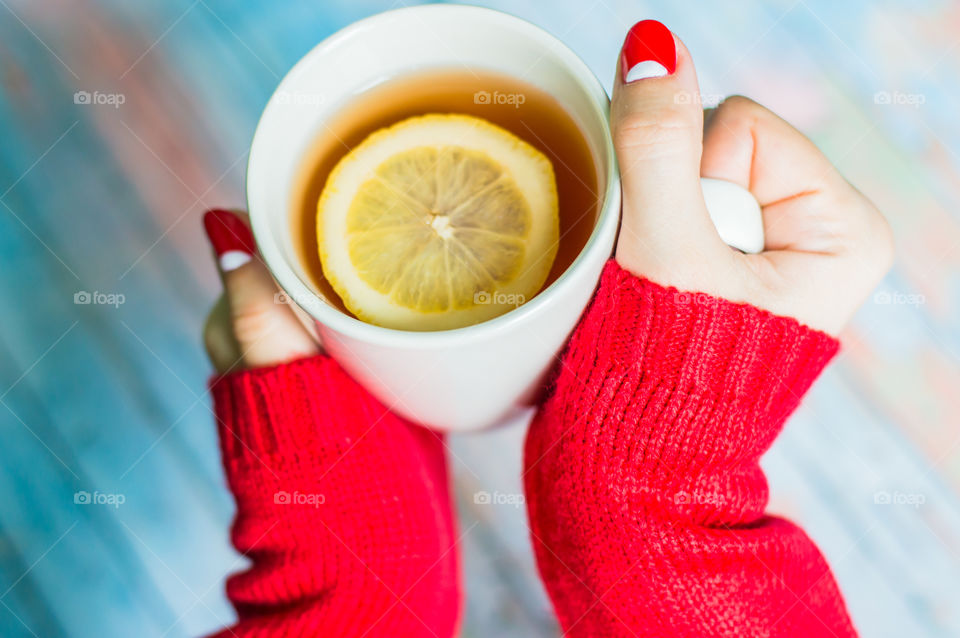 woman hand with cup of tea