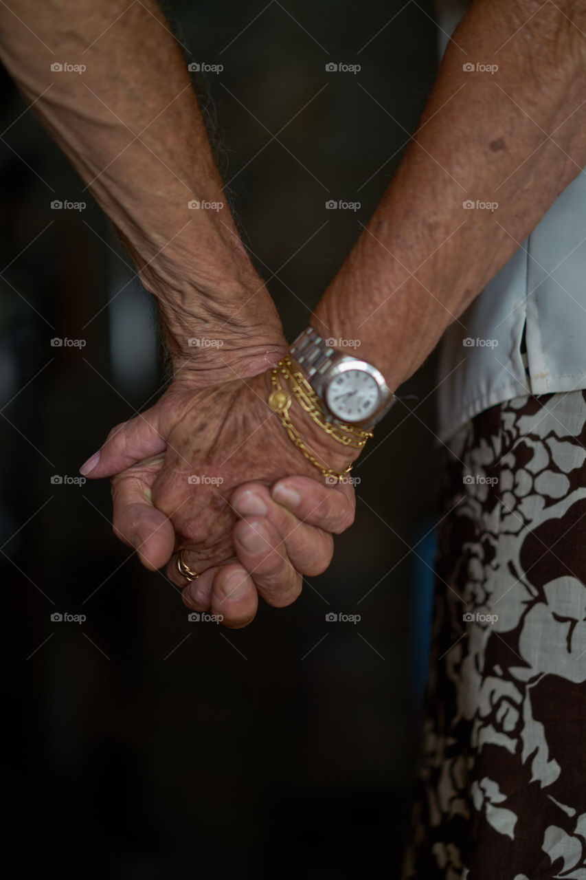 Couple holding hands