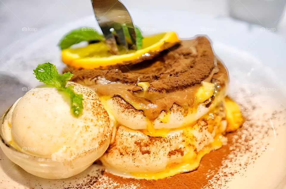 pancake with orage sauce with ice cream