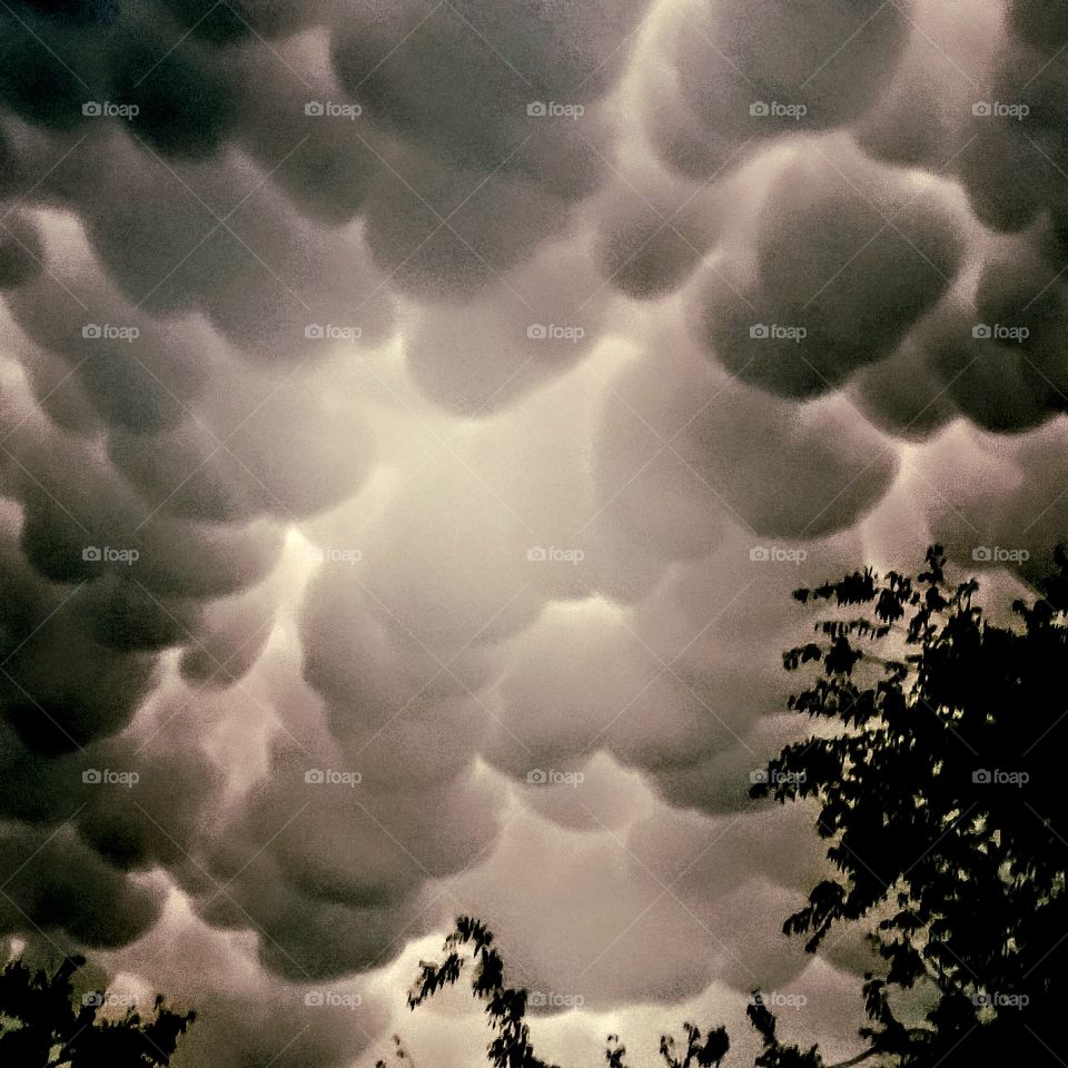 Ominous Mammatus clouds lurking eerily in the sky.
