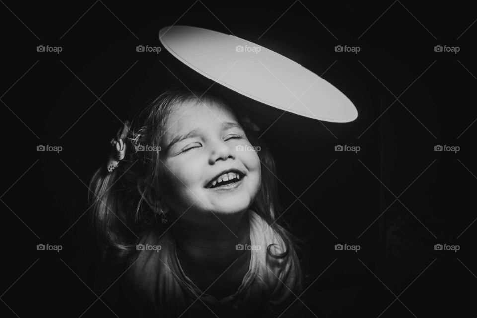 Little girl and light. Black and white.