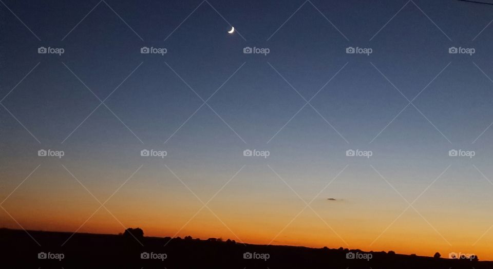 quarter moon at sunset