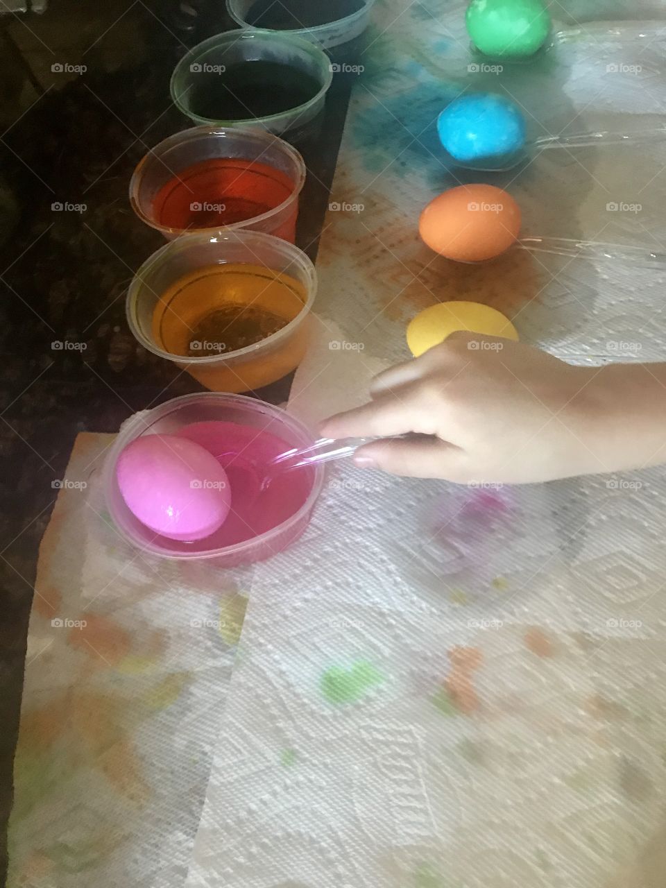 Child dying Easter eggs 