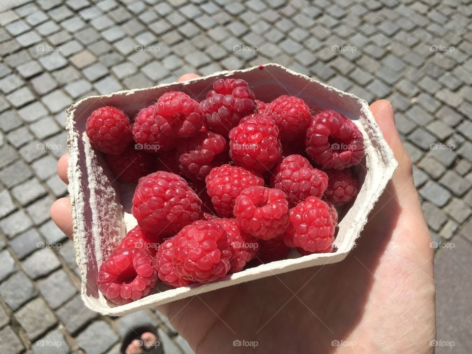 Raspberry in a hand