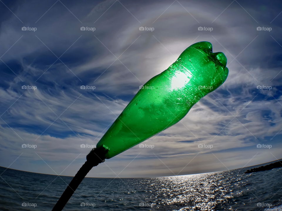 plastic bottle and steel and sun