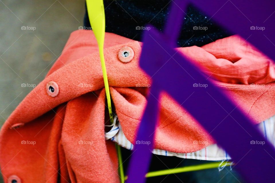 Colorful jacket laying on a colorful chair 