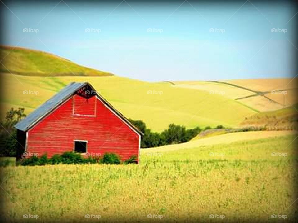 old rustic red barn in the country