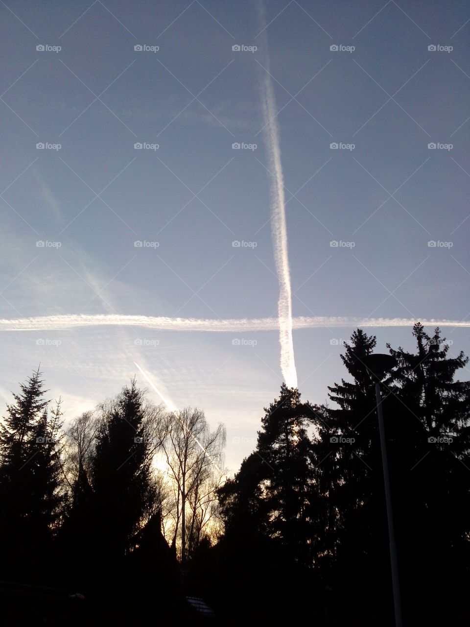 Vapor trails crossing in the sky