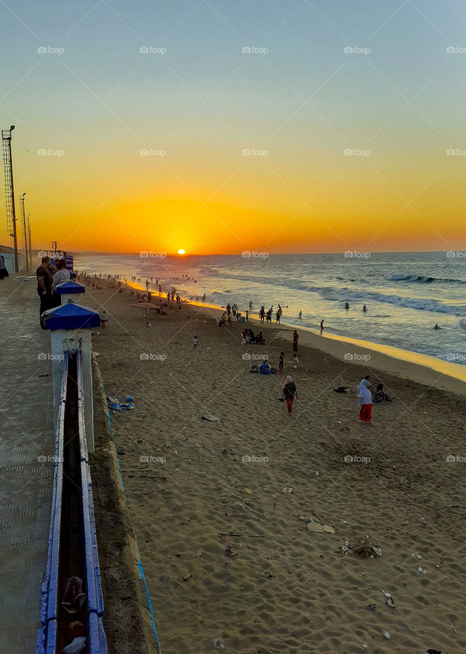 sunset throw the beach
