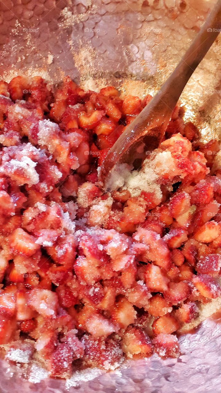 Cooking homemade strawberry jam