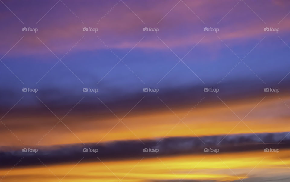 Beautiful light of Sunset with clouds in the sky reflection.