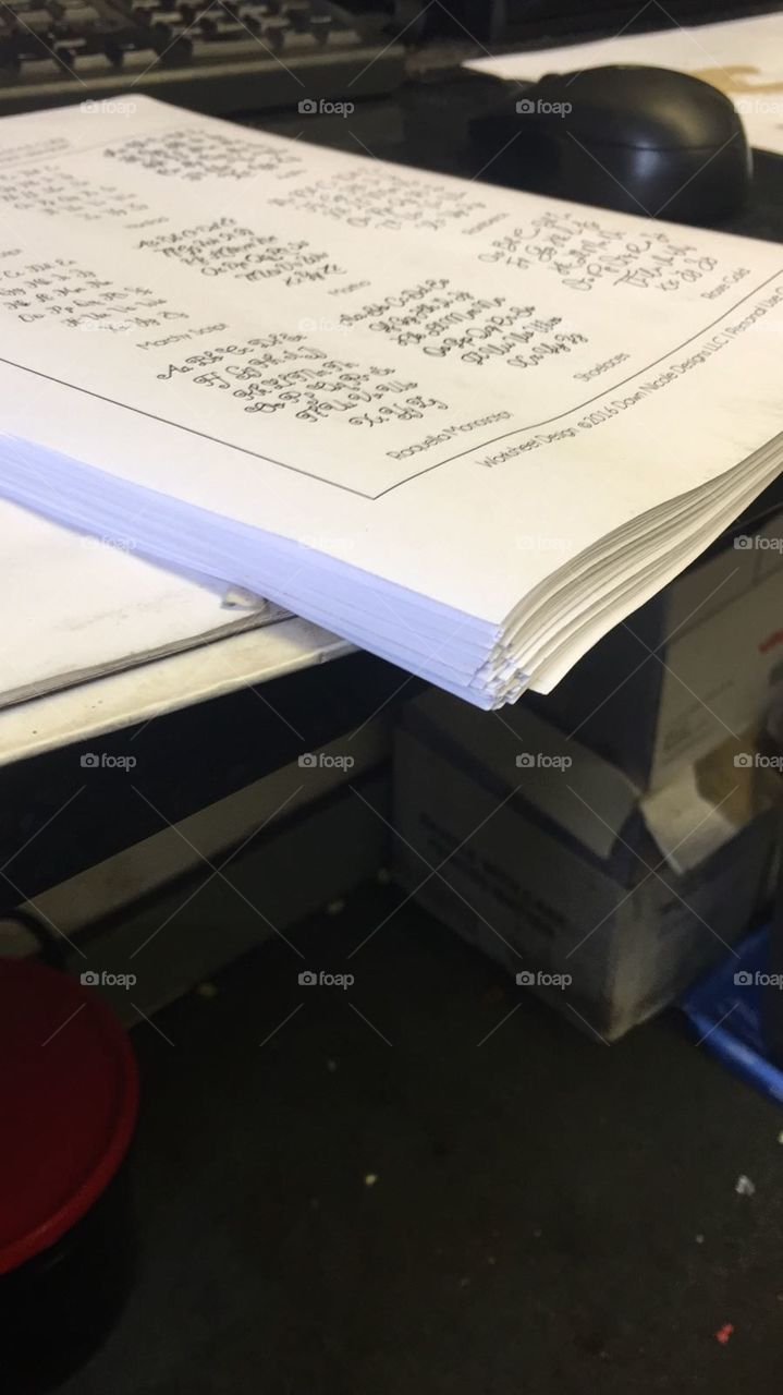 Stack of paper on a desk in a workshop