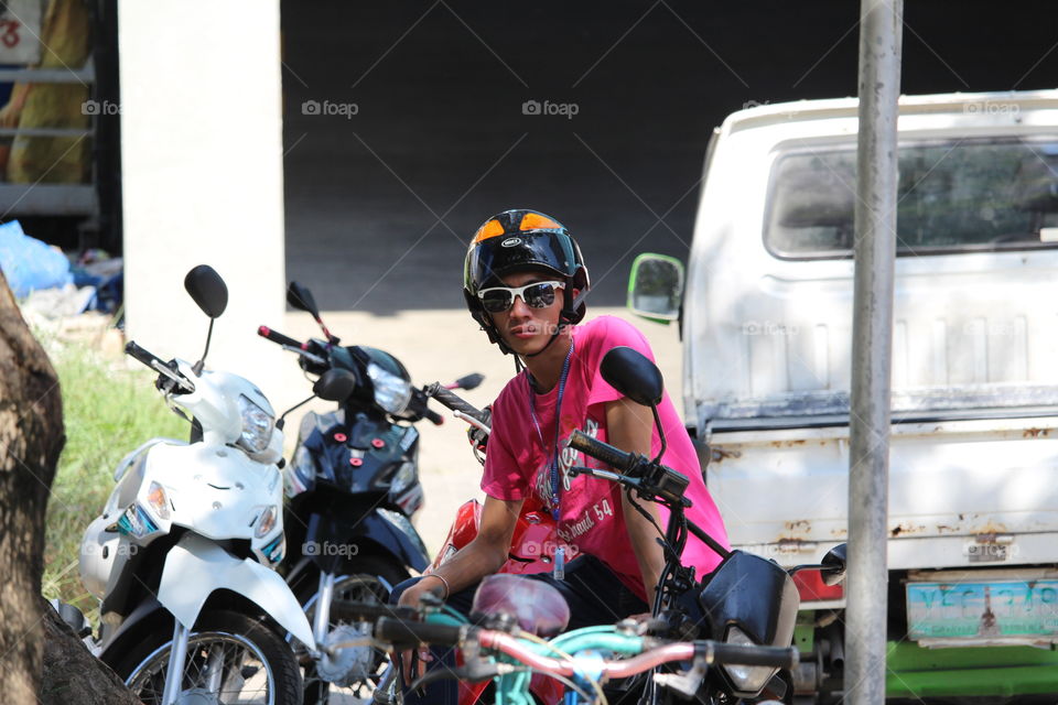 Young man on motorbike Cebu City Philippines 