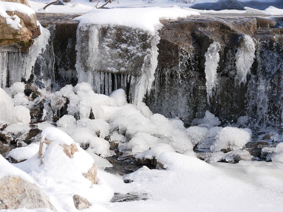 A walk through a winter wonderland, minutes into the local downtown area. Ice, snow, trees, water, and a little wildlife for good measure!