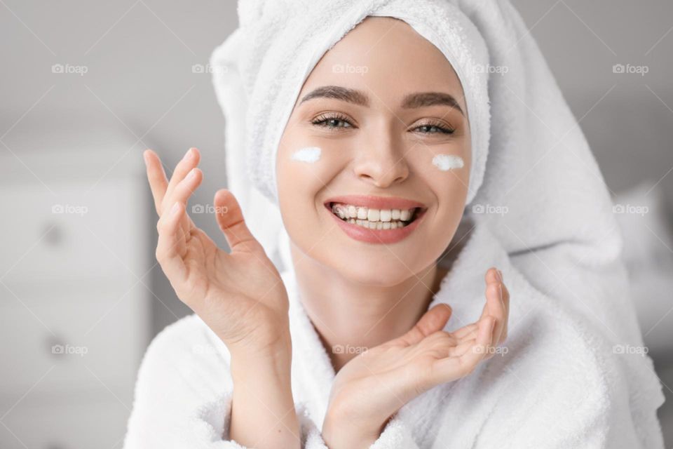 Women with face cream on the face
