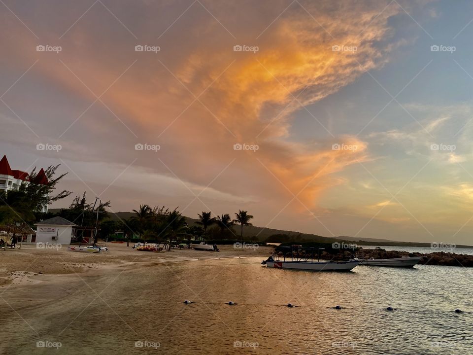 Beautiful sunset by a beach in the Bahia Principe Grand Jamaica hotel area 