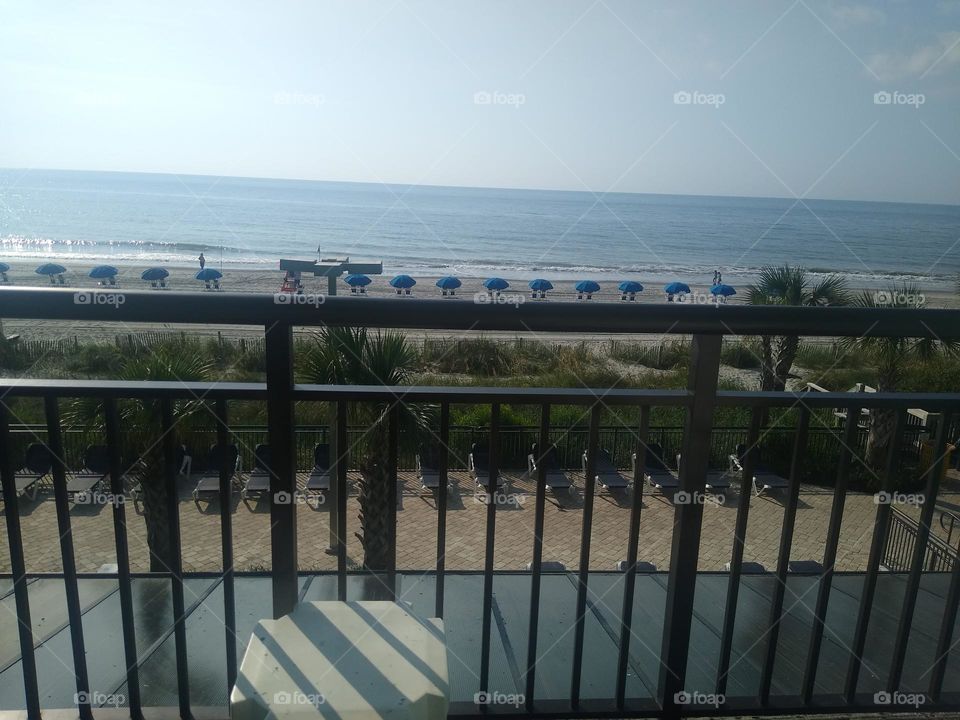 North Carolina ocean and beach view from a hotel room balcony 