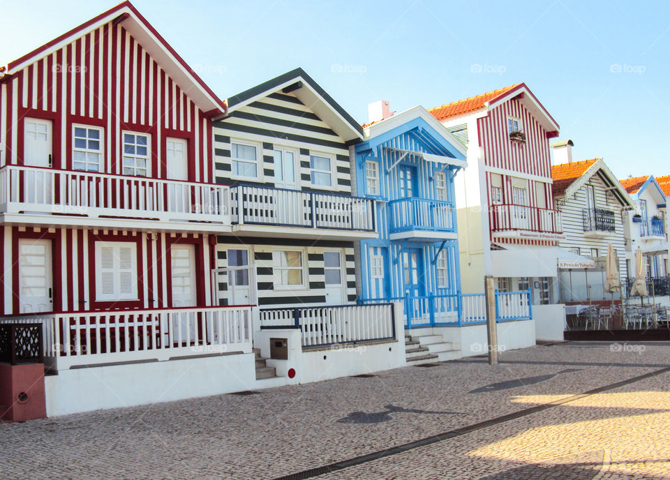 Striped facades of colorful houses in Portugal