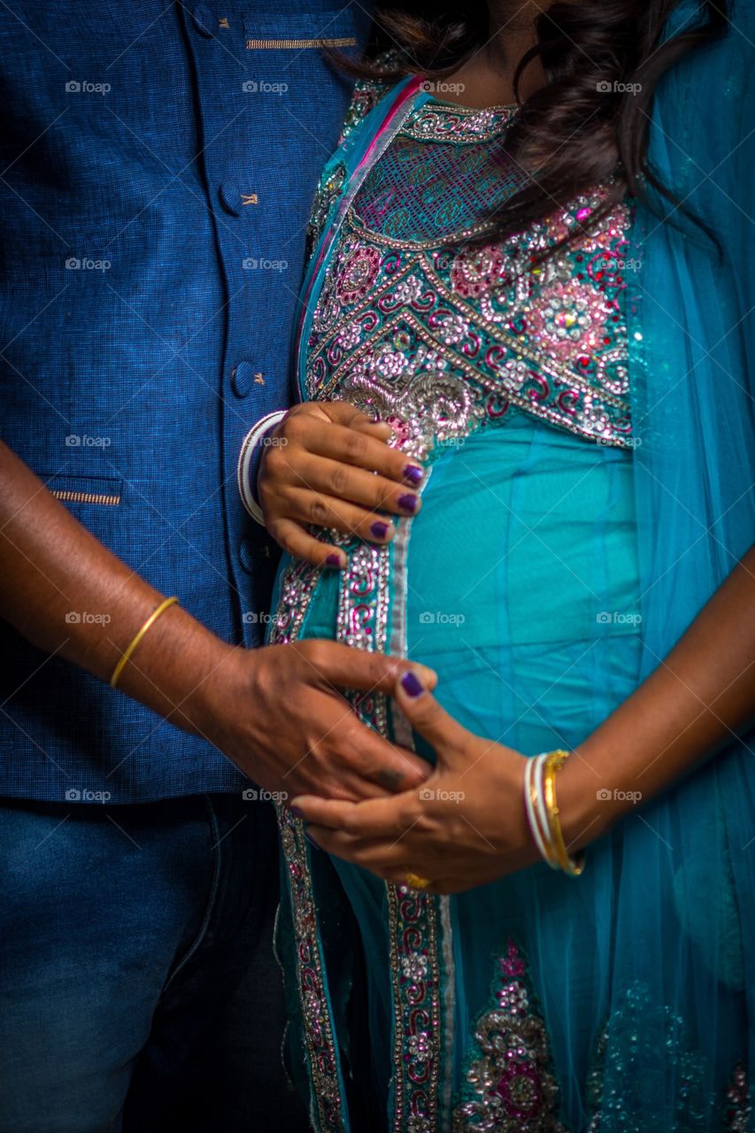 Two adult Indian couple celebrating pregnancy