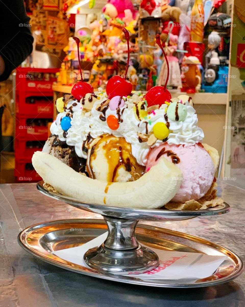 large ice cream with cream and fruit