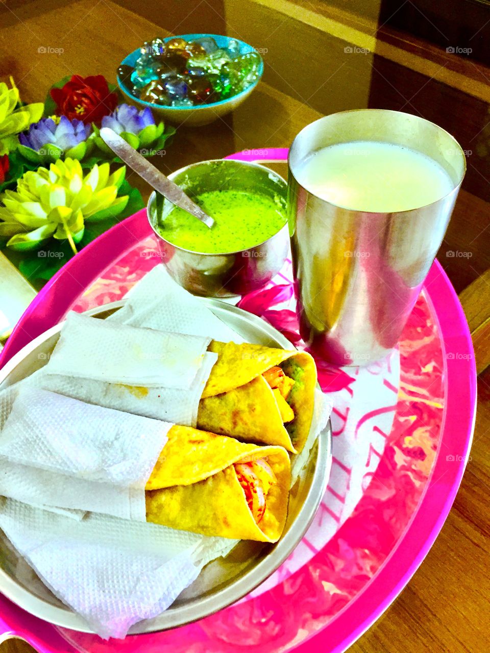 Delicious Kathi Rolls with milk and green chutney.