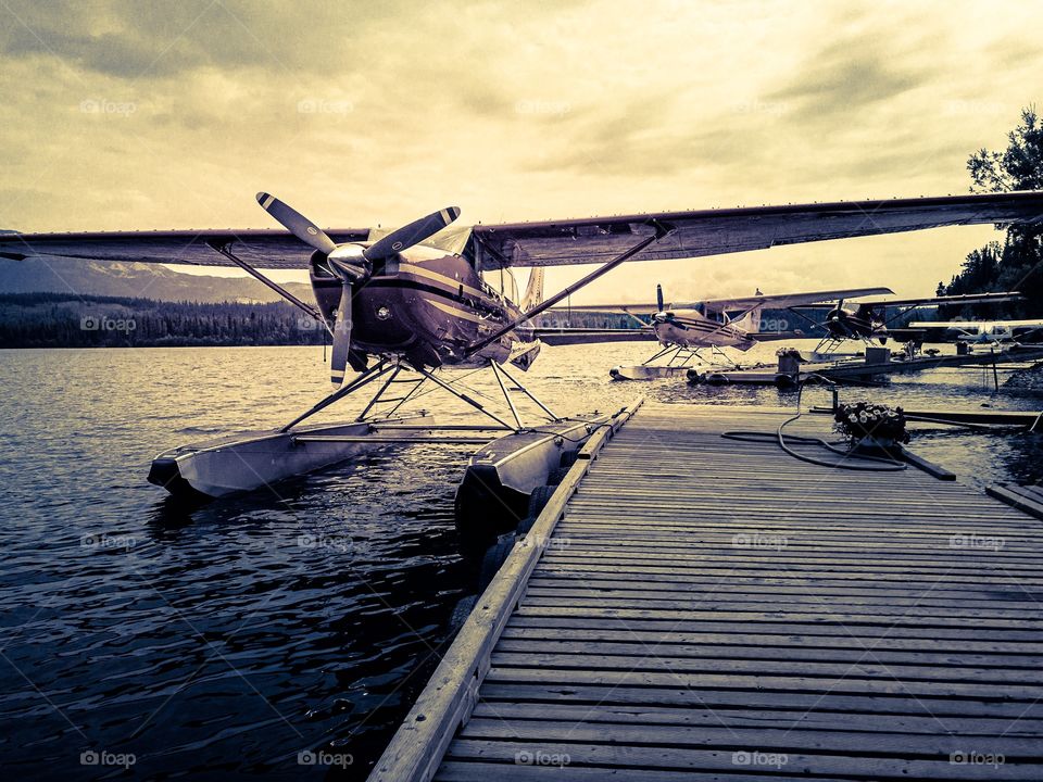 Float planes at sunrise on Schwatka Lake in the Yukon Territory 