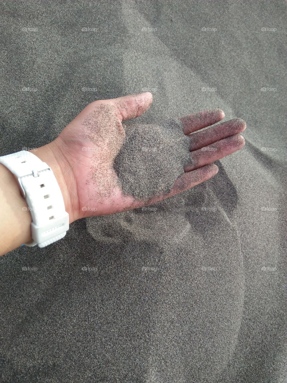 the sand in my grasp