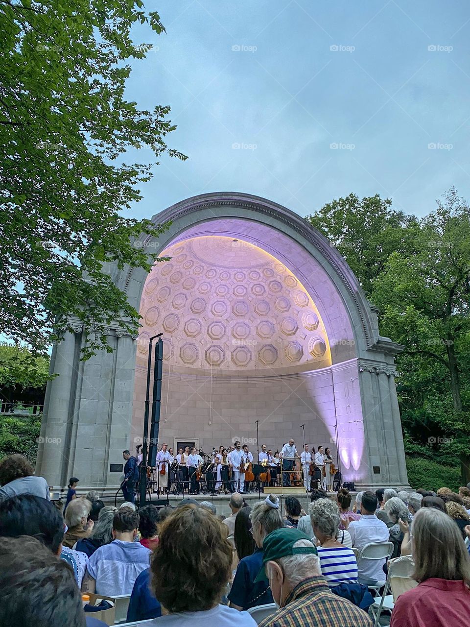 People watching live Naumburg Orchestral Concerts - The Knights. Summer 2023. Central Park New York. 