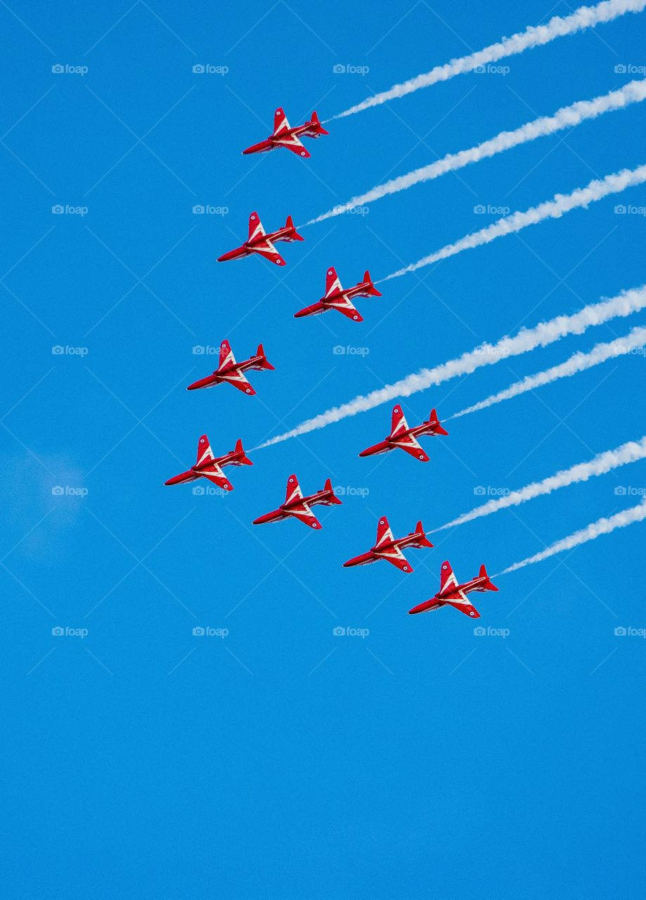 red arrows display team with vapor trails