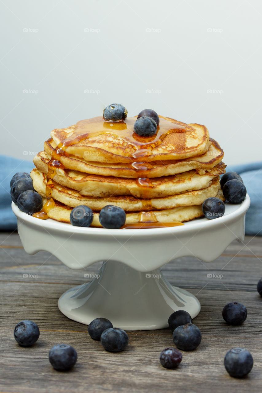 stack of pancakes on a cake stand