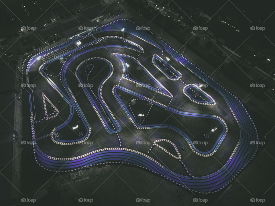 Drone Aerial view of a Go kart racing track at night