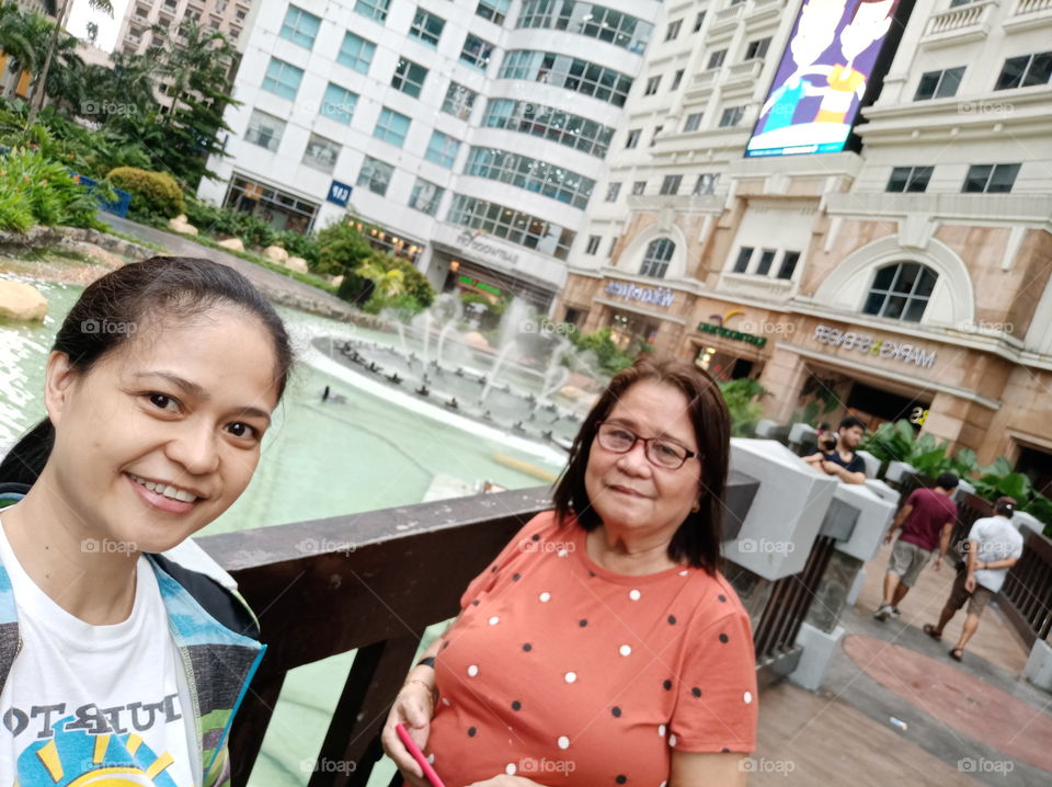 Me and my Tita  Zenaida just have fun walking along together at Eastwood City, Philippines.